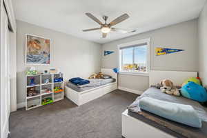 Bedroom featuring carpet floors and a ceiling fan