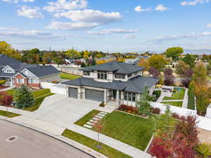 Prairie-style house with a residential view, concrete driveway, and a garage