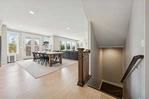 Dining room featuring recessed lighting, light wood-type flooring, and radiator
