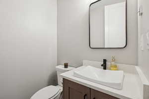 Half bath with vanity and toilet