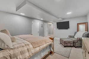 Bedroom featuring recessed lighting and light carpet