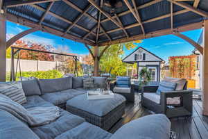 Deck featuring an outbuilding and outdoor lounge area
