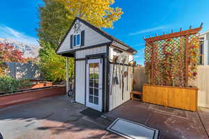 View of outdoor structure with a fenced backyard