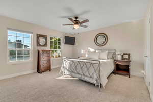 Bedroom featuring carpet and ceiling fan