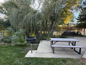 View of property's community with a patio area and outdoor dining space