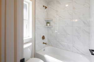 Bathroom with  shower combination and toilet