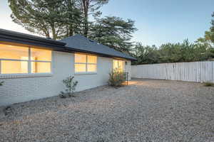 View of side of home featuring brick siding