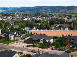 Aerial perspective of suburban area featuring mountains