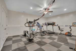 Exercise area with recessed lighting and a ceiling fan