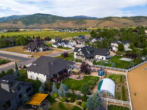 Aerial perspective of suburban area featuring a mountainous background