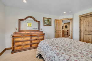 Bedroom featuring recessed lighting and carpet