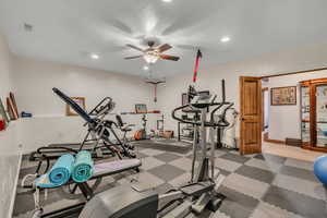 Workout room with recessed lighting and ceiling fan