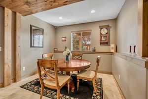 Dining area with recessed lighting and baseboards