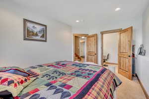 Bedroom featuring recessed lighting and carpet flooring