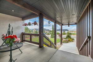Covered porch with a residential view