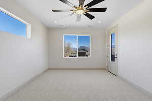 Unfurnished room featuring light carpet, recessed lighting, and ceiling fan
