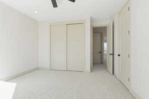Unfurnished bedroom with light colored carpet, recessed lighting, a closet, and a ceiling fan