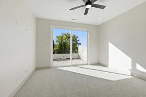 Empty room with light carpet, ceiling fan, and recessed lighting