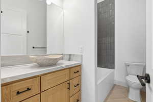Bathroom with vanity and light tile patterned flooring