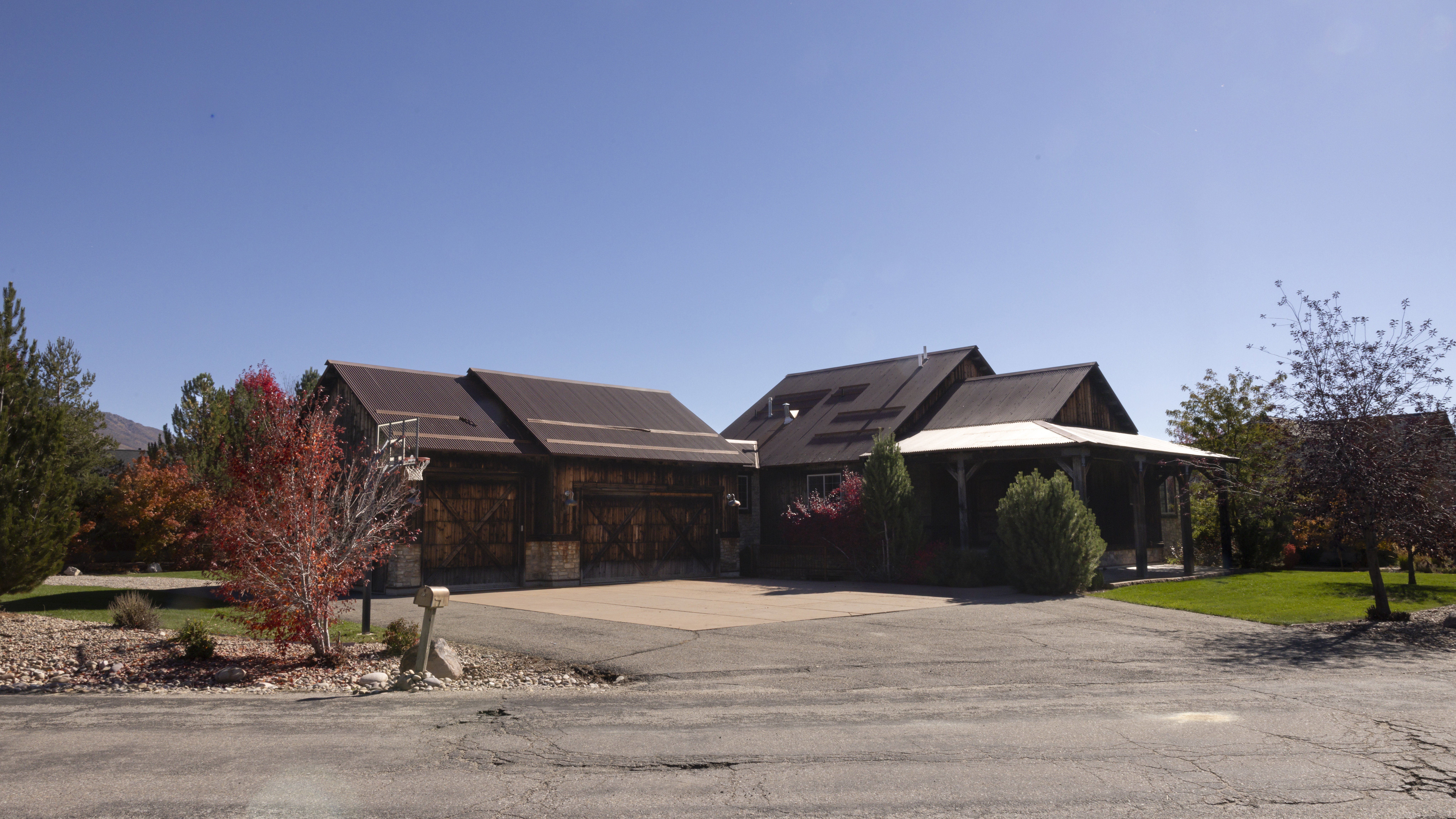 View of front facade with driveway and a garage