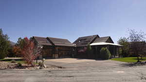 View of front facade with driveway and a garage
