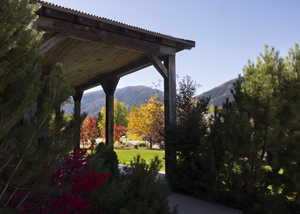 View of green lawn featuring a mountain view