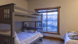 Bedroom with carpet floors and baseboards