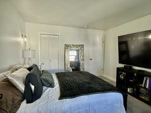 Bedroom featuring carpet flooring and a closet