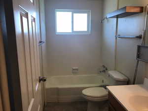 Upstairs bathroom featuring vanity, tub and shower combination