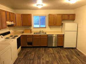 Garden level kitchen with free-standing range, fridge and dishwasher. Tenants supply their own washers and dryers