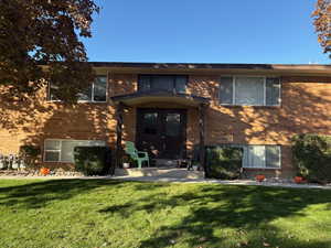 Front of building with two units up and two on the garden level