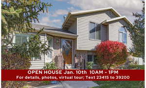 View of front of house featuring brick siding and roof with shingles