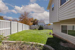 View of fenced backyard
