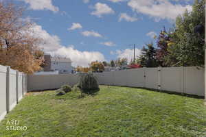 Fenced backyard with a gate