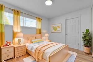Bedroom with light wood-style floors