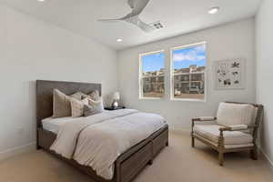 Bedroom with carpet flooring, ceiling fan, and recessed lighting