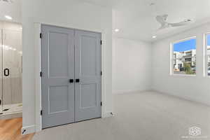 Unfurnished bedroom with recessed lighting, light carpet, a closet, and ceiling fan