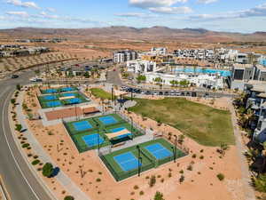 Aerial view of a mountain backdrop and a pool