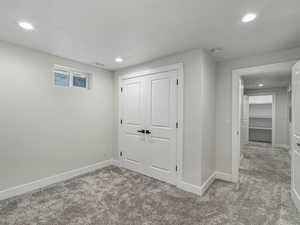 Basement with carpet and recessed lighting