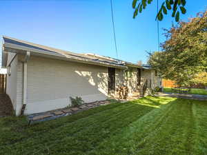 View of property exterior featuring brick siding