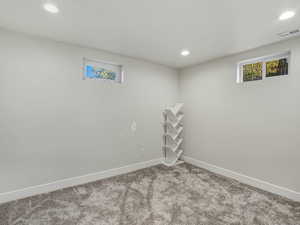 Basement with recessed lighting and carpet flooring