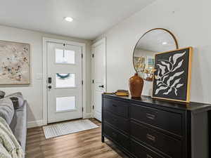 Foyer featuring light wood-type flooring and recessed lighting