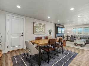 Dining space featuring recessed lighting and light wood finished floors