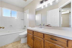 Bathroom with vanity,  shower combination, and light tile patterned floors