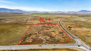 Aerial view of sparsely populated area with mountains and property boundaries highlighted