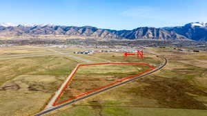 Overview of rural landscape featuring property parcel outlined and mountains