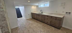 Kitchen with dark brown cabinets
