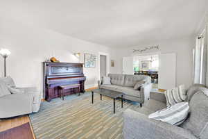 Living room with a chandelier and wood finished floors