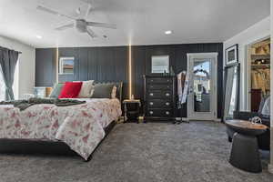 Carpeted bedroom with access to exterior, a textured ceiling, ceiling fan, and recessed lighting