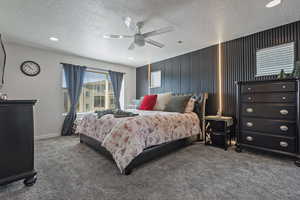 Bedroom featuring carpet, a textured ceiling, recessed lighting, and a ceiling fan
